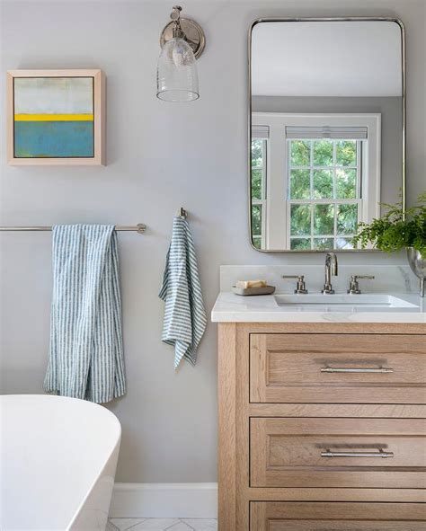 Light Brown Oak Washstand With Honed White Marble Waterfall Countertop