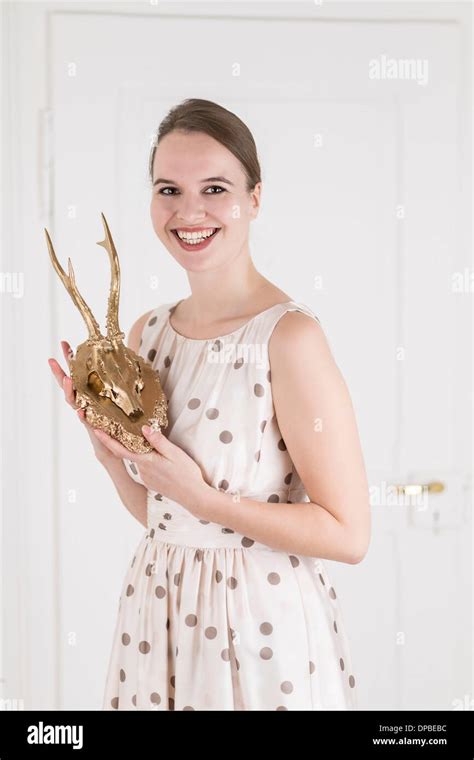 Young Woman Holding Golden Deer Antlers Stock Photo Alamy