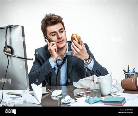 Slacker Man Talking On The Phone While Eating At Work Modern Office