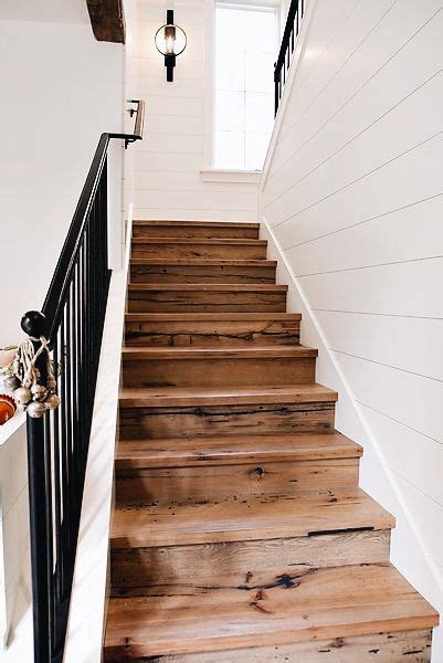 The Stairs Are Made Out Of Wood And Have Been Painted White With Black