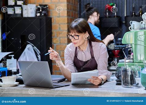 Colleagues Partners Man And Woman Behind Counter In Coffee Shop Stock