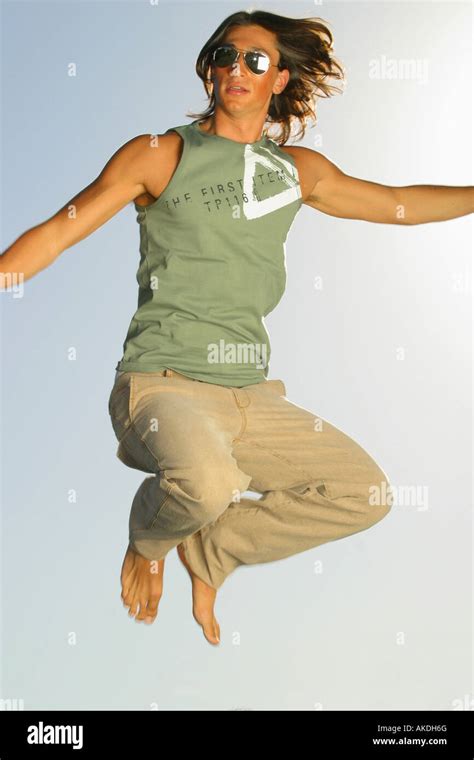 A person jumping very high into the air Stock Photo - Alamy