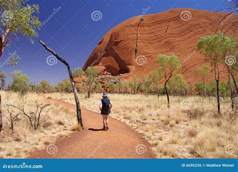 Woman Hiking Around Uluru Royalty Free Stock Image - Image: 6695256