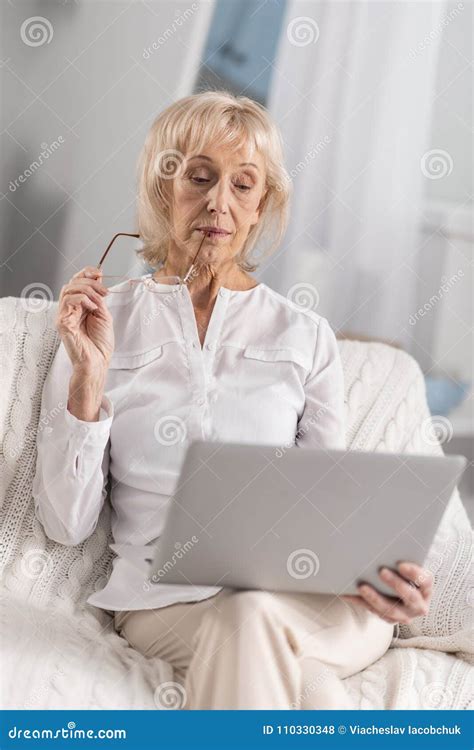 Pensive Mature Woman Sitting With Laptop Stock Photo Image Of Electronics Life