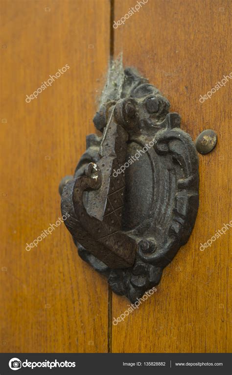 Wooden door with knocker — Stock Photo © Olivia #135828882