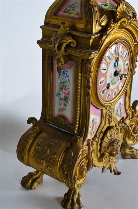 Phillipe Mourey French Gilt Mantel Clock With Sèvres Style Panels Ebth