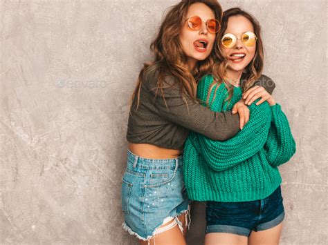 Portrait Of Two Hot Beautiful Women Posing In Studio Stock Photo By Halayalex