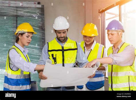 Group Of Construction Worker Team Working Together Discussion Looking