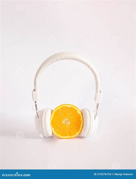 Orange With White Headphonesmodern Visual Aesthetic Idea Stock Photo