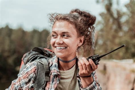 Beaming Female Hiker Feeling Cheerful While Meeting Her Friend In