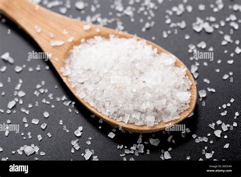 Sea Salt In Wooden Spoon Stock Photo Alamy