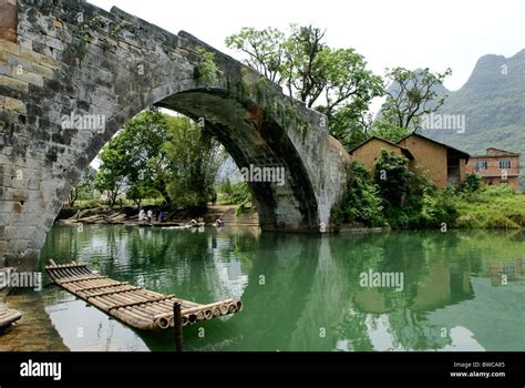 Bamboo raft on river at Yulong Bridge, Guangxi, China Stock Photo - Alamy