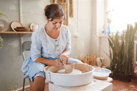 Premium Photo Female Master Making A Pot On Pottery Wheel Woman