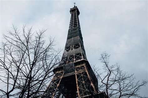 Low Angle Closeup Of The Famous Eiffel Tower Surrounded By Trees In