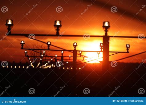 runway lights stock photo image  runways sunset