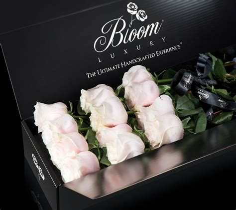 Roses In A Black Box With The Name Bloom Luxury