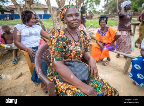 A woman in traditional dress poses for the camera in Ganta, Liberia Stock Photo - Alamy