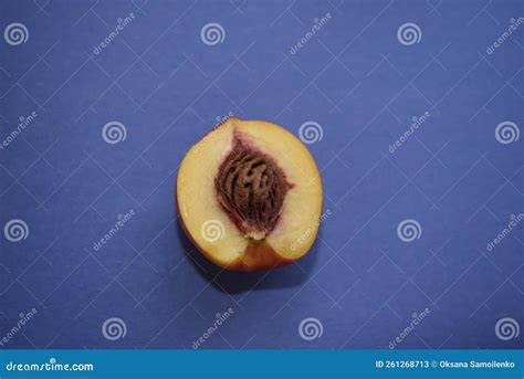 Sliced Peach Slice With Pit On A Blue Background Useful Fruits Close Up Stock Image Image Of