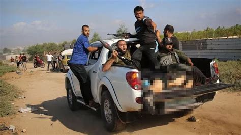 Outrage As Photo Of Hamas Parading Shani Louk S Naked And Mutilated