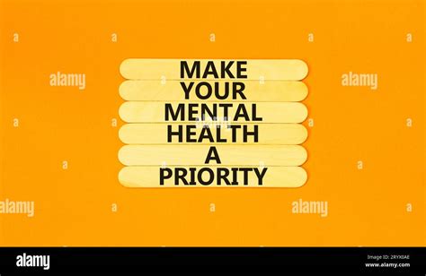 Mental health psychological symbol. Concept words Make your mental health a priority on wooden ...