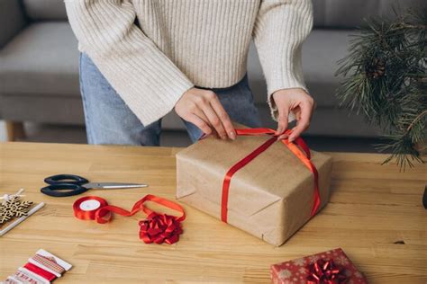 Premium Photo Woman Wrapping Christmas Presents Gifts