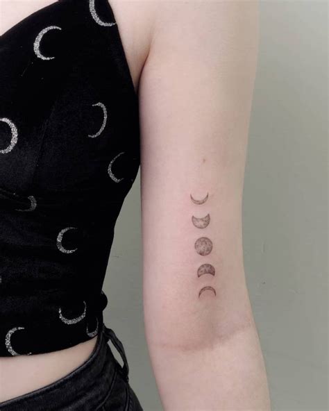 Moon Phases Tattoo Located On The Bicep