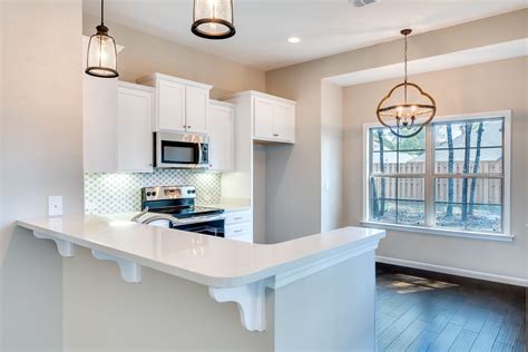 Gorgeous Kitchen With Stainless Steel Appliances Granite Countertops And Off White Custom