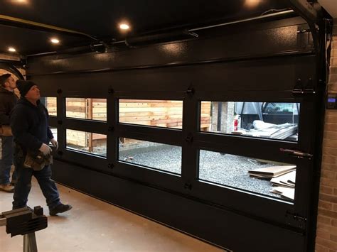 Installation of Contemporary Black Glass Garage Doors in Toronto