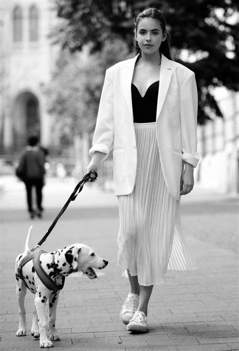 Beautiful Female Model Walking with Dog in Summer City in Europe ...