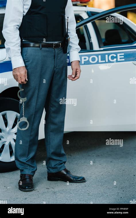 Police Officer Holding Handcuffs Hi Res Stock Photography And Images