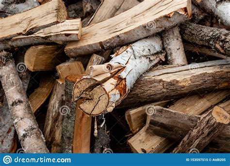 Split Dry Firewood Ready For Winter Background Of Logs Birch Pine