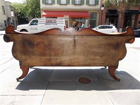 Caribbean Regency Mahogany Carved Foliage Leather Sofa On Brass Casters