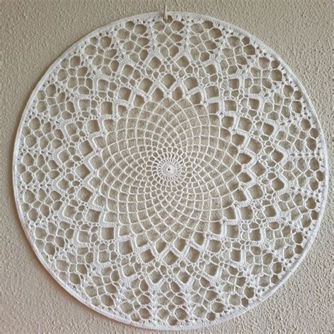 A White Doily Hanging On The Wall