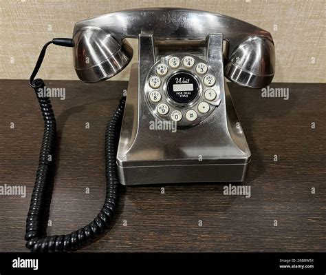 Vintage Looking Brushed Metal Rotary Dial Desk Telephone Stock Photo