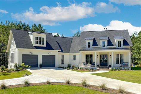 CUSTOM HOME OF THE WEEK Modern Farmhouse With Angled Garage