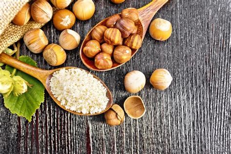 Premium Photo Hazelnut Flour In A Spoon Nuts In A Bag Spoon And On