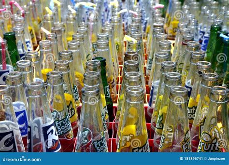 Empty Bottles Of Soft Drinks And Other Fruit Soda In Their Case