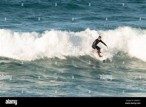 Surfer Standing Up Surfing A Wave Stock Photo Alamy