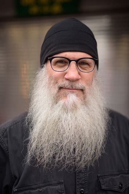 Premium Photo Face Of Mature Handsome Bearded Man With Eyeglasses In