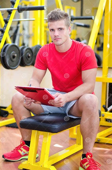 Young Male Personal Trainer Holding Clipboard Stock Image Image Of