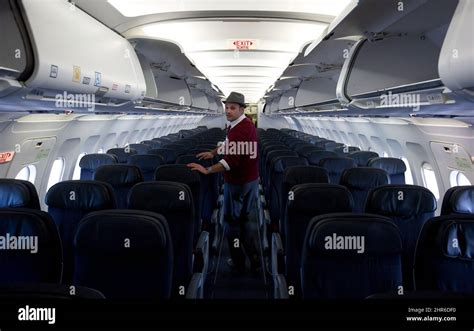 Flight Attendant Bryan Wyshnicki Prepares An Air Canada Rouge Airbus