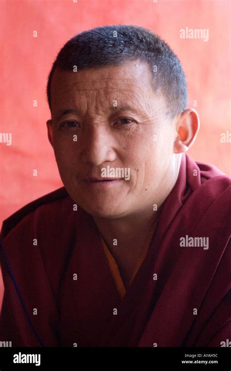 Tibetan Buddhist Monk Backlit By Window In The Drepung Monastary In