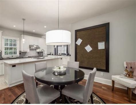 A Dinning Room Table And Chairs In A Kitchen