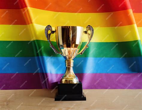 Premium Ai Image Gold Trophy With Background Flag Lgbt