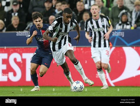 Alexander Isak Of Newcastle United Battles Vitinha Of Paris Saint