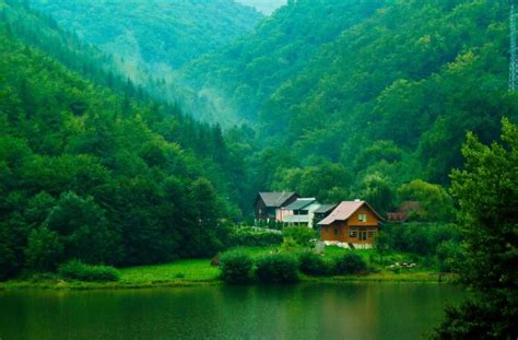 House Near Body Of Water Surrounded By Mountains Hd Wallpaper