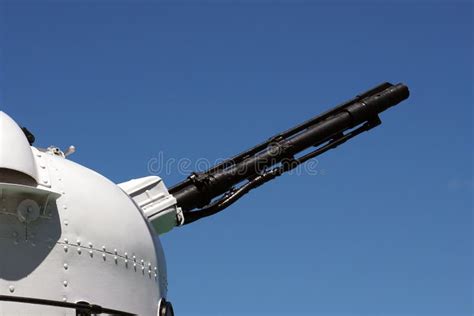 Naval Ship Artillery Gun Barrel On A Blue Sea Background Copy Space