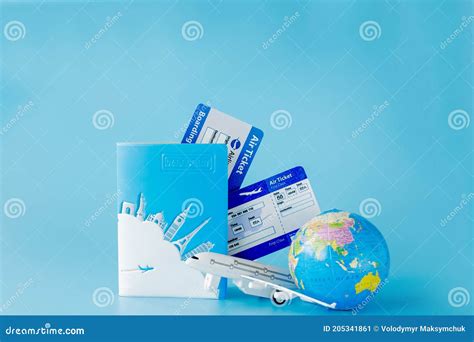 Flight Tickets With Passports Model Of Airplane And Globe On Blue