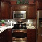 Medallion Cherry Peppercorn Cabinets With Rococo Quartz Countertops