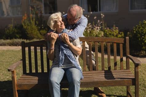 Premium Photo Senior Couple Embracing Each Other In The Park